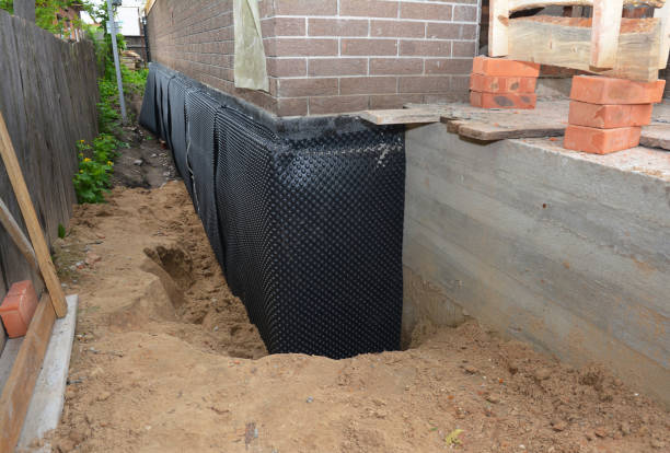 Happy homeowners after waterproofing job in Caneadea